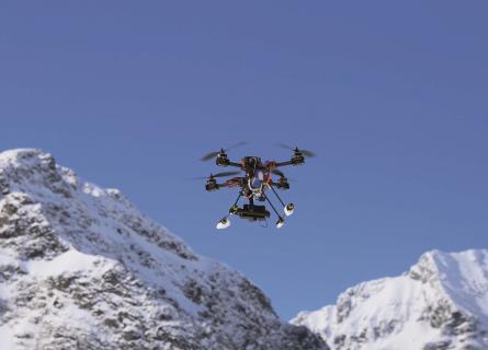 drone flying over mountain tops in the arctic